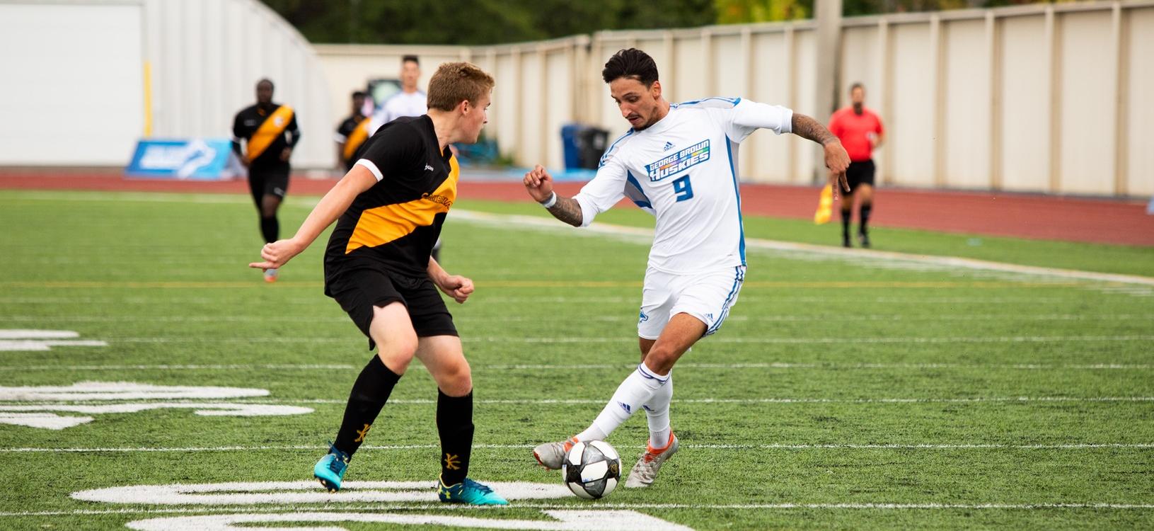 Huskies' Vilela attacks Cambrian defender
