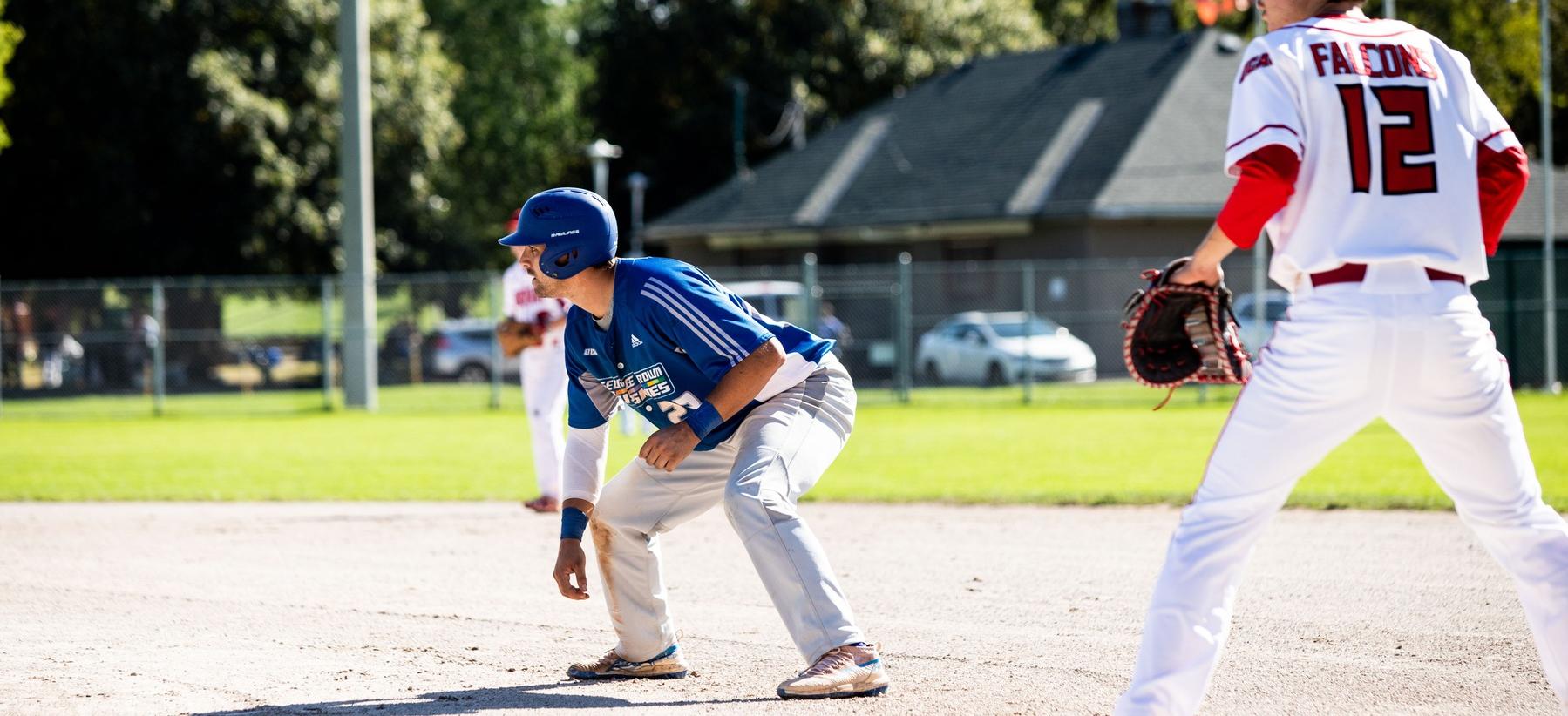 Huskies baseball player leading off first base