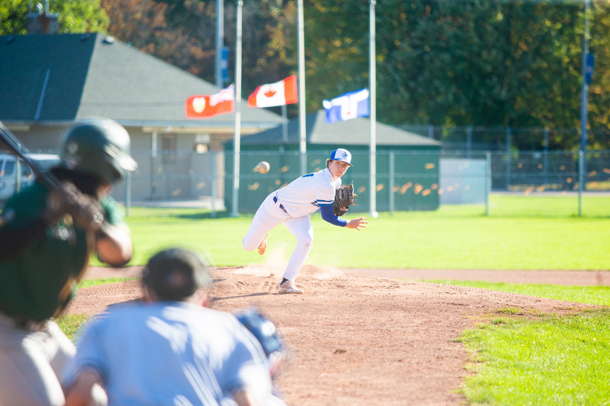 Huskies pitcher throws ball to Durham batter