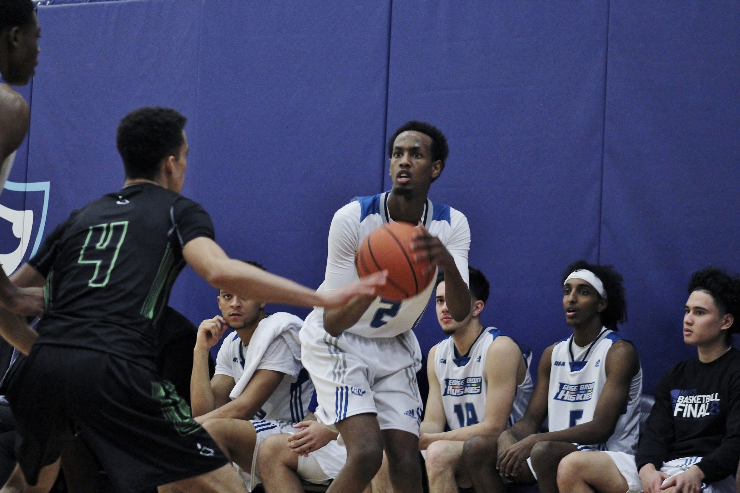 LIBAN MOHAMED SCORES 57 POINTS AS HUSKIES MEN'S BASKETBALL SPLIT PAIR ON OPENING DAY OF EAST/WEST HOLIDAY CLASSIC
