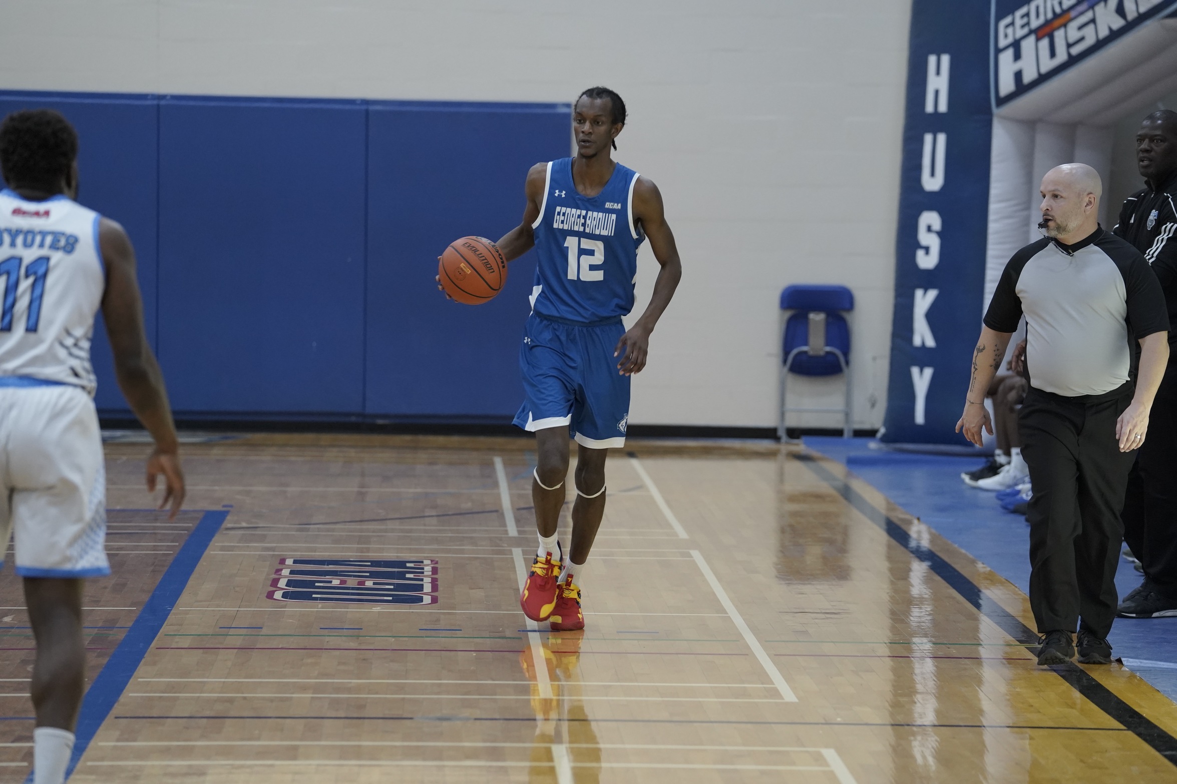 HUSKIES DROP CLOSE GAME TO LOYALIST