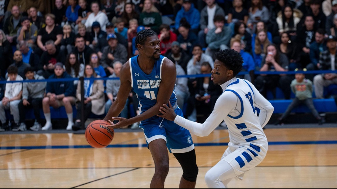HUSKIES EDGED OUT BY GEORGIAN