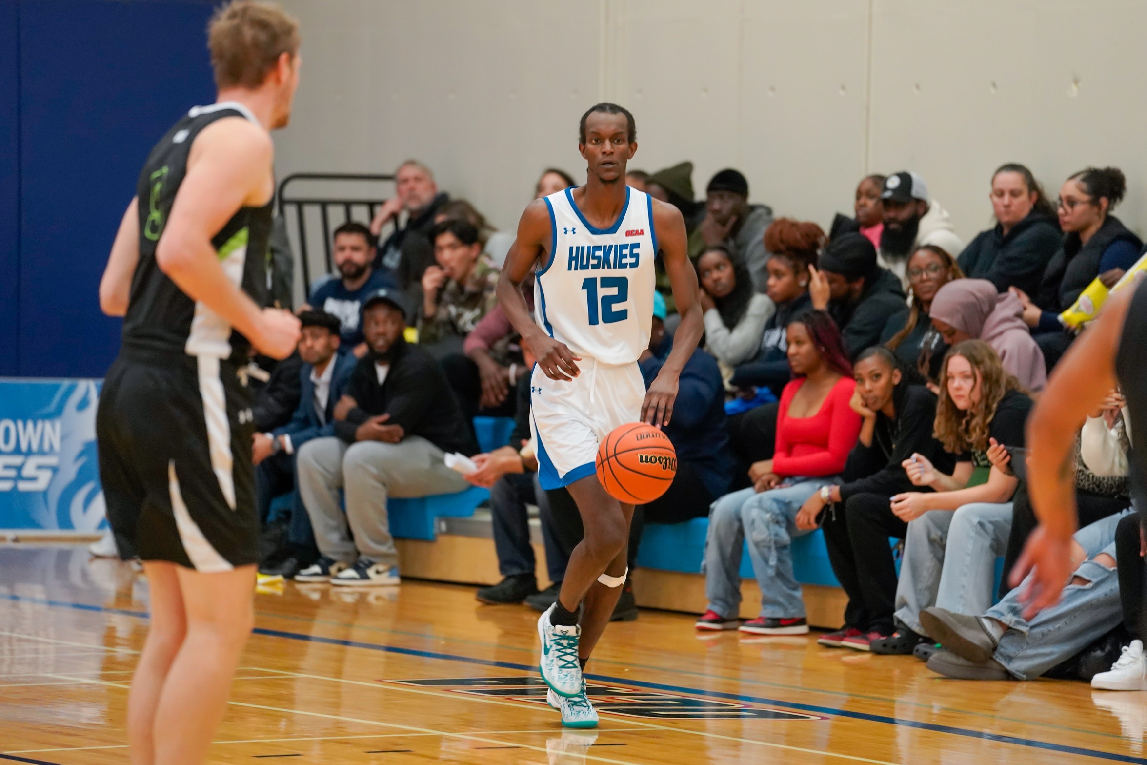 HUSKIES DROP DECISION TO ALGONQUIN
