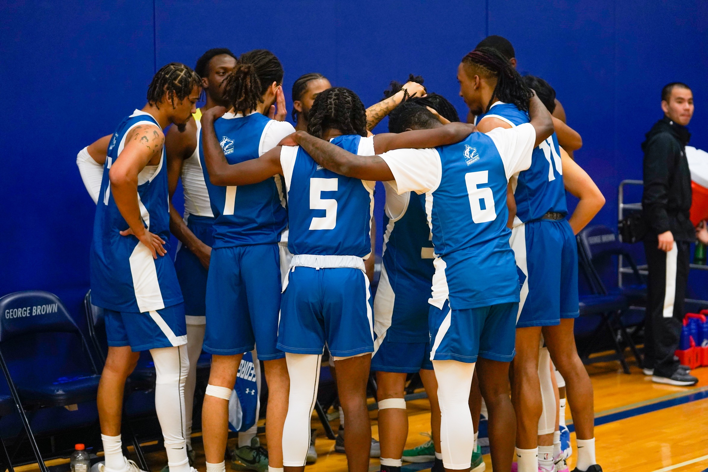HUSKIES FALL IN CLOSE PLAYOFF BATTLE
