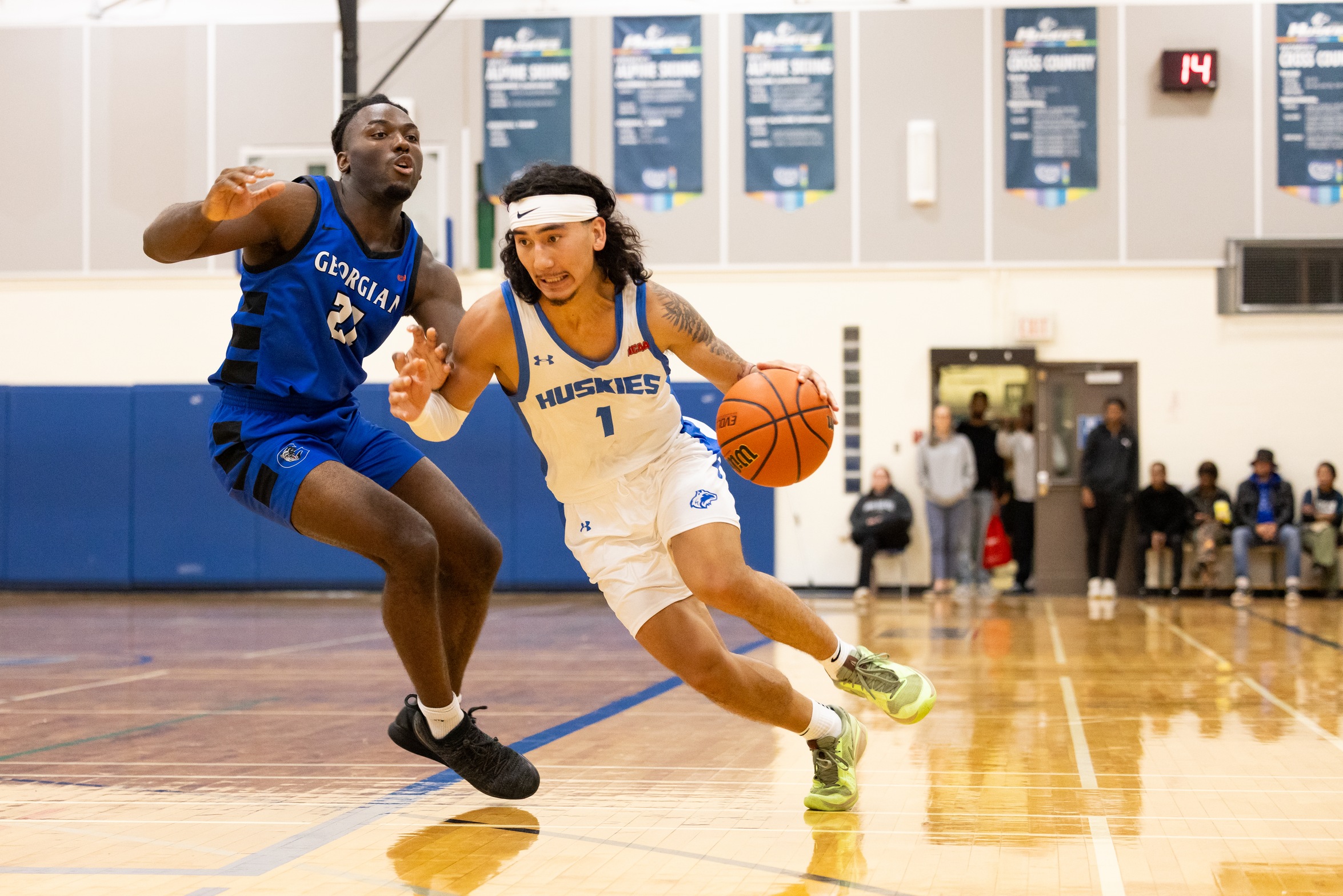 HUSKIES FALL IN HOME OPENER