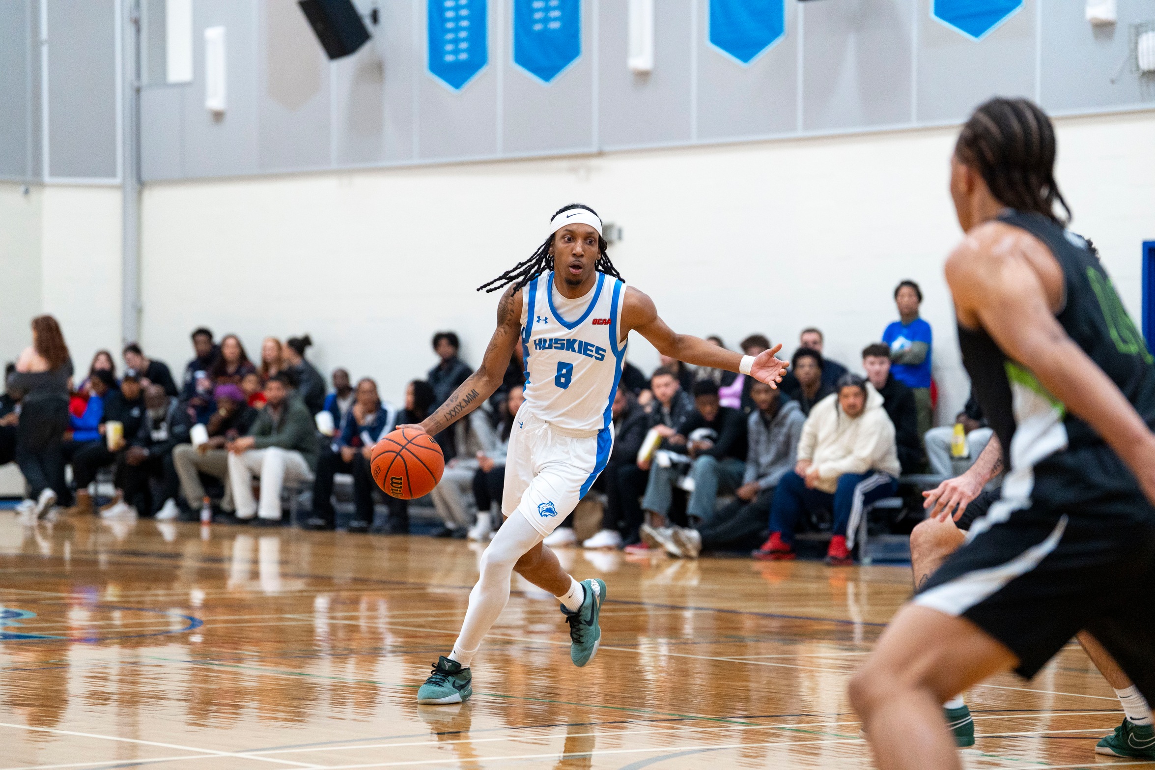 HUSKIES EDGE OUT SURGE