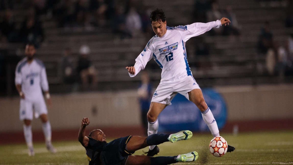 HUSKIES DROP HOME OPENER TO HAWKS
