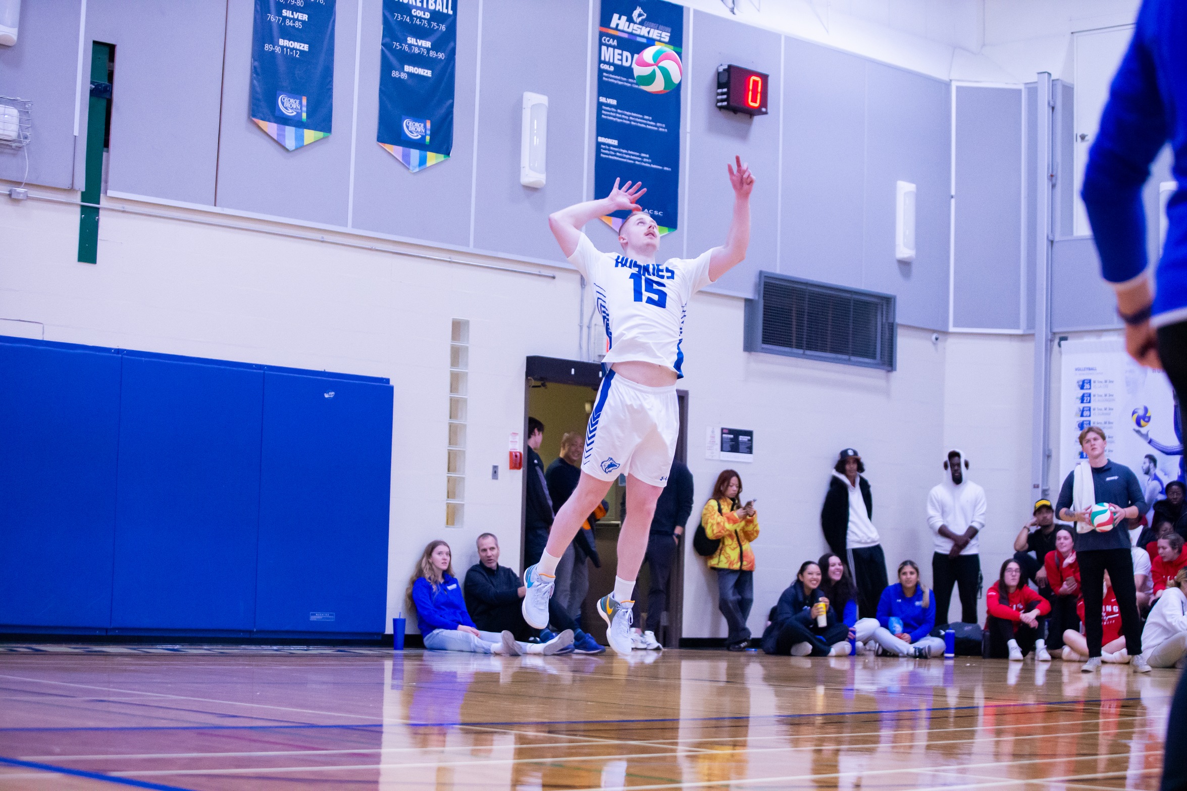 FROEBEL, HUSKIES DROP FIVE-SET THRILLER