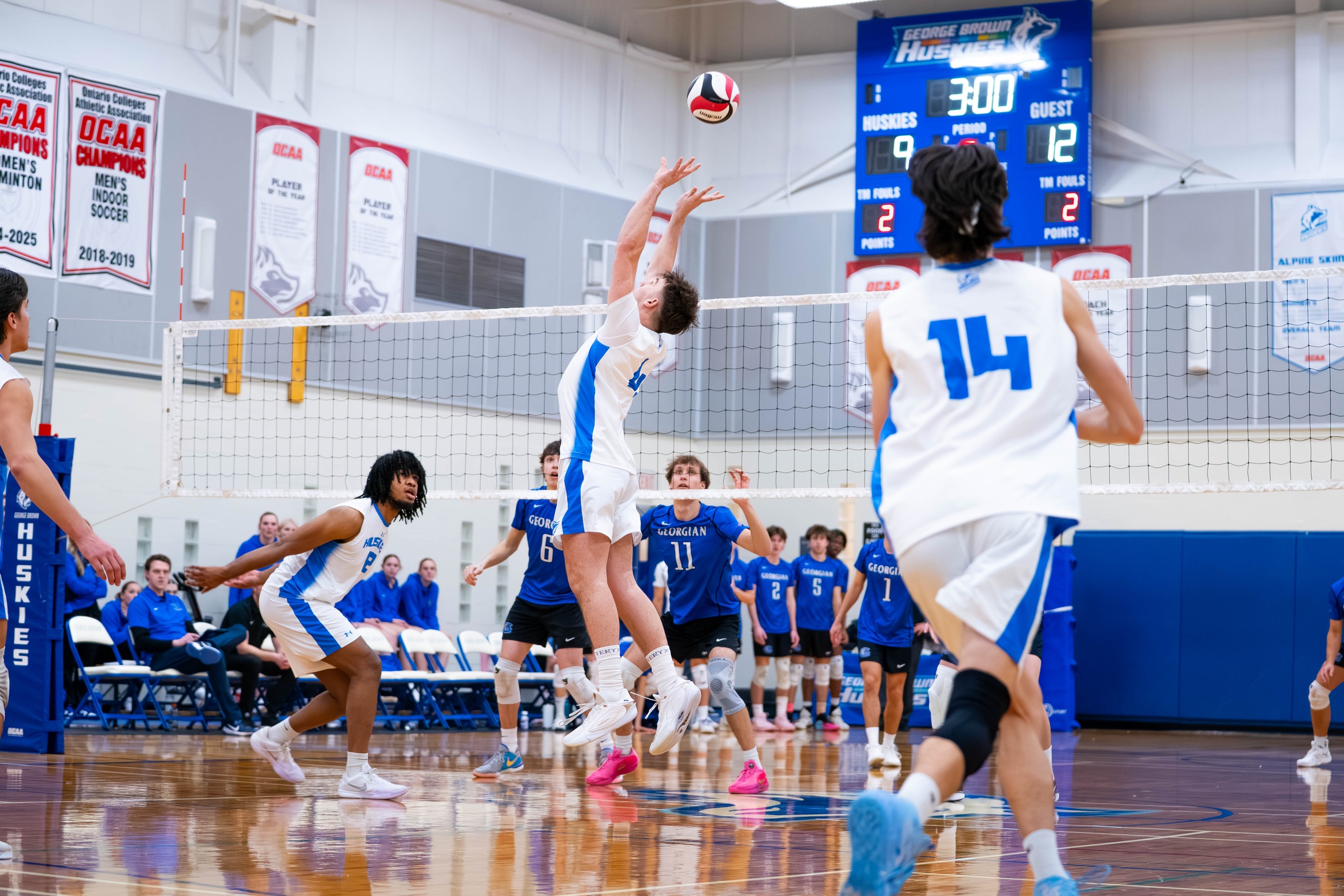 HUSKIES DROP FIVE-SETTER