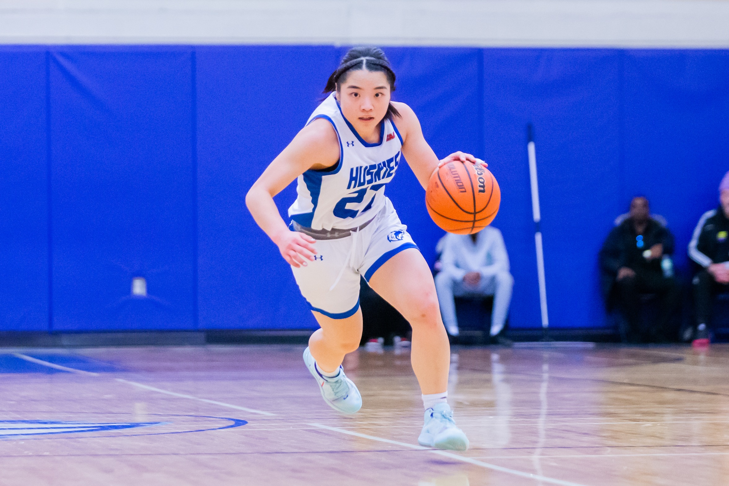 #23 dribbles ball up court