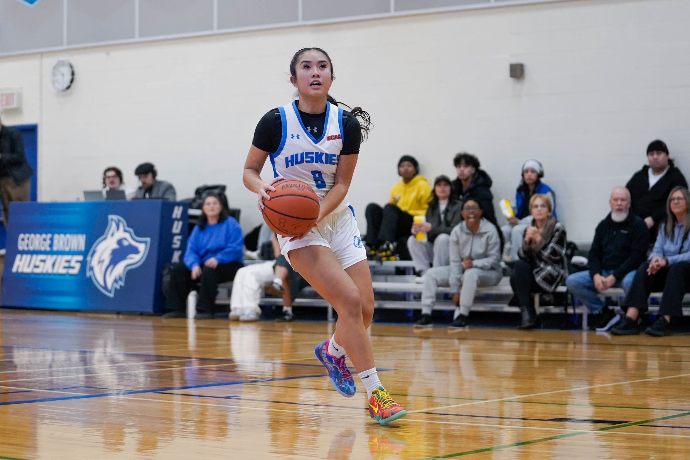HUSKIES EDGED OUT BY LOYALIST