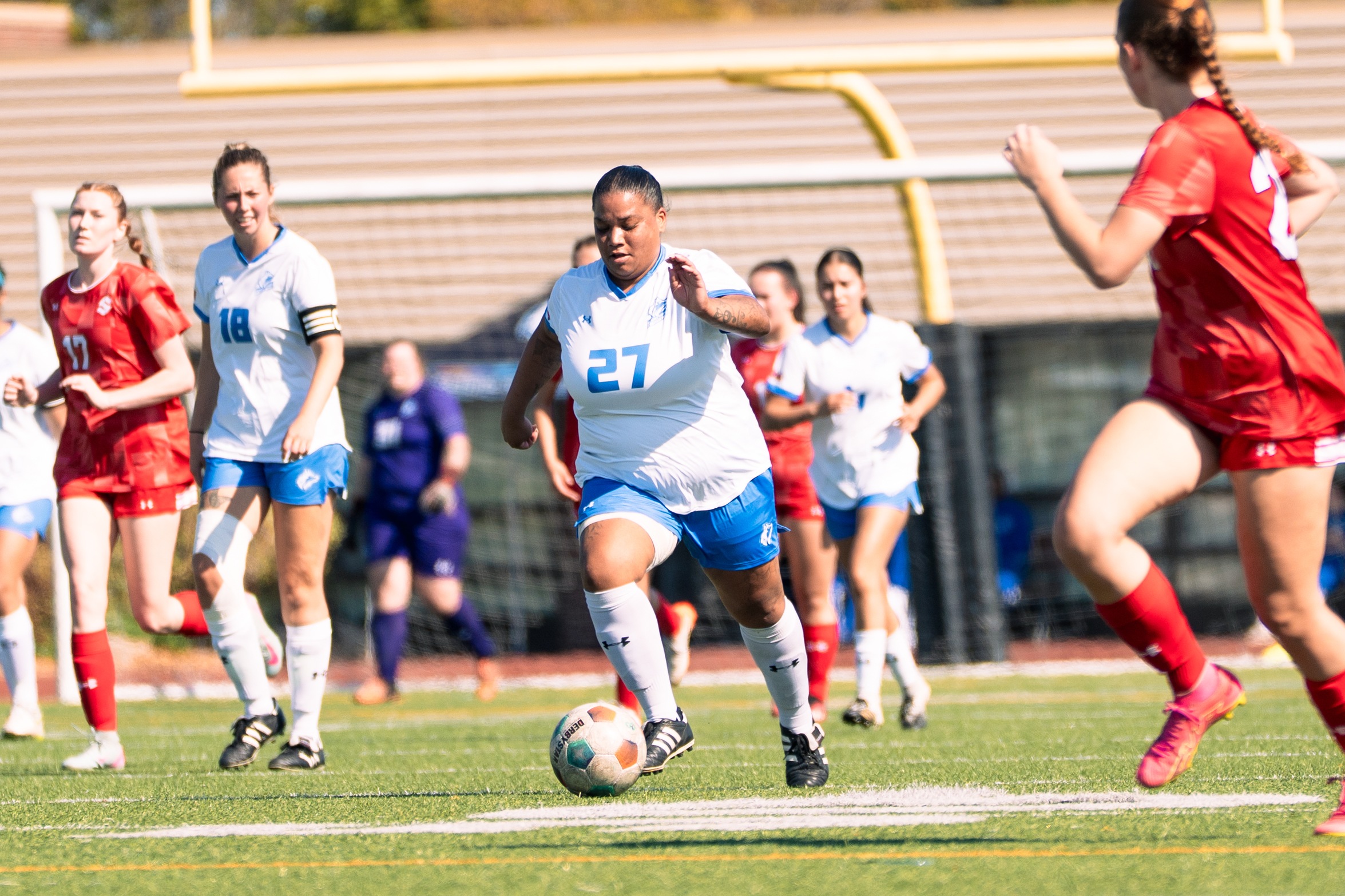 HUSKIES FALL TO SURGE