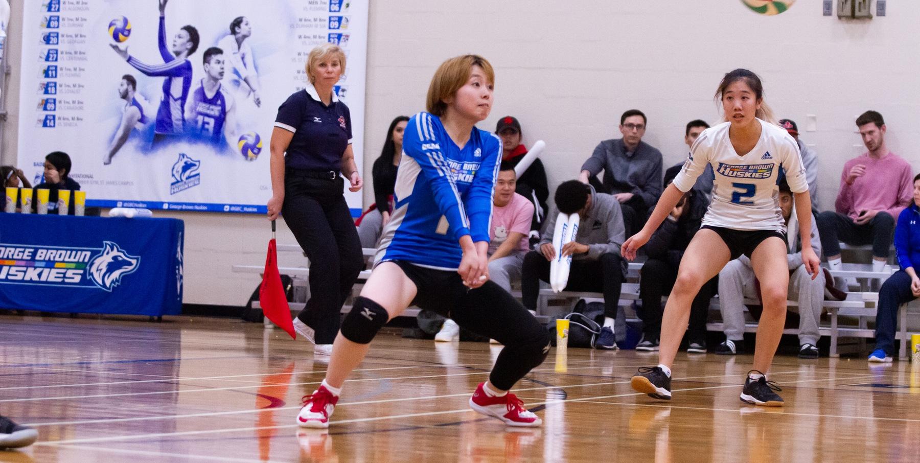 Huskies volleyball setter hits ball