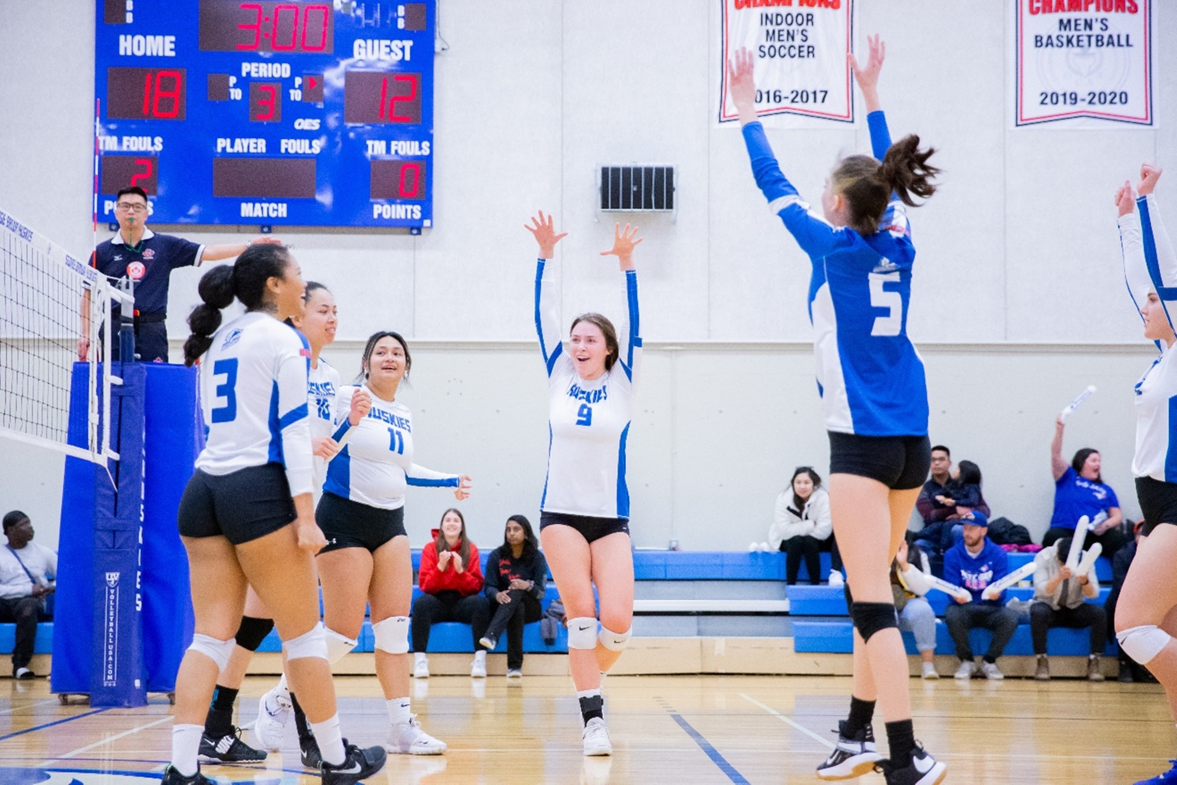 Women's volleyball team celebrates point