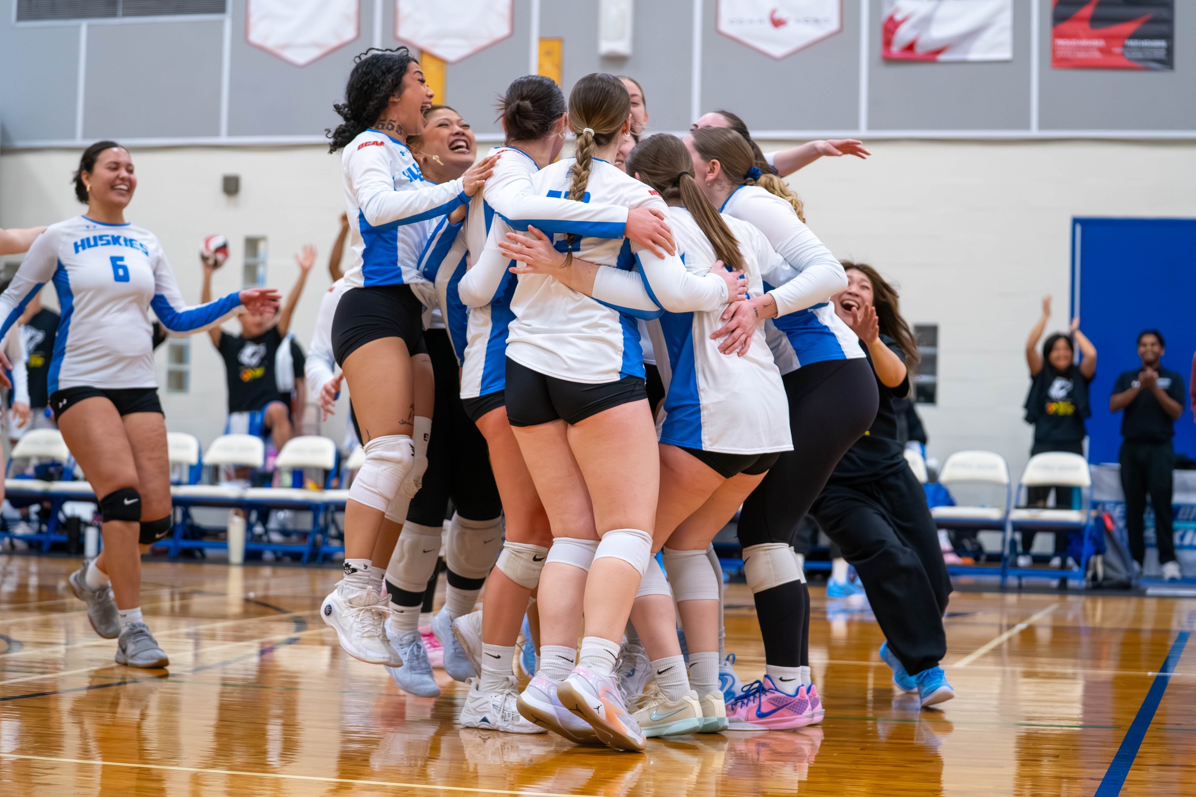 HUSKIES TAKE FIVE-SETTER