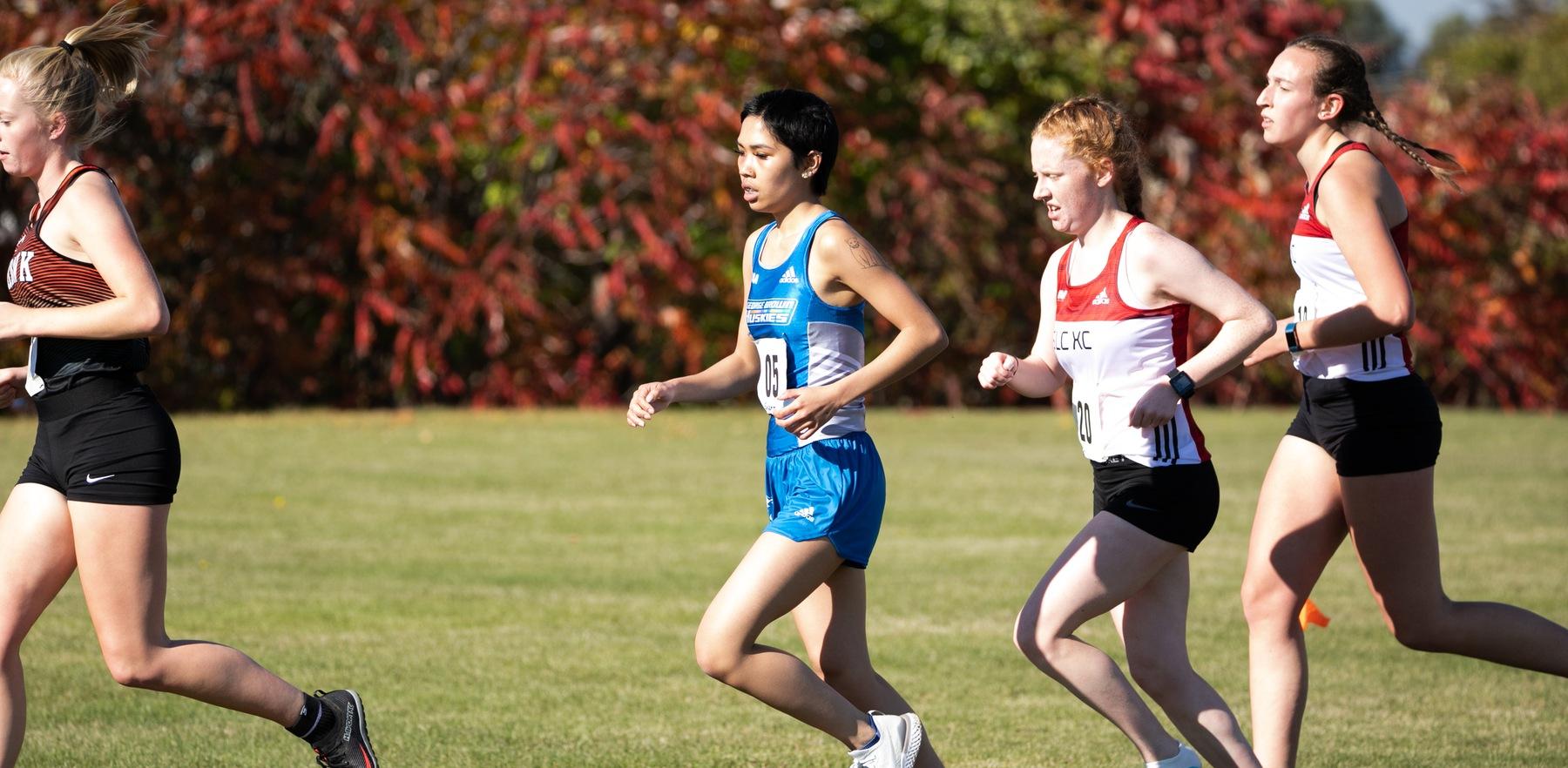 Huskies cross country runner in race
